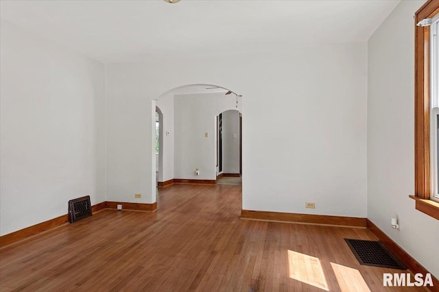 1529 W Reed Ave, Springfield, IL 62704 - unfurnished room with arched walkways and wood finished floors