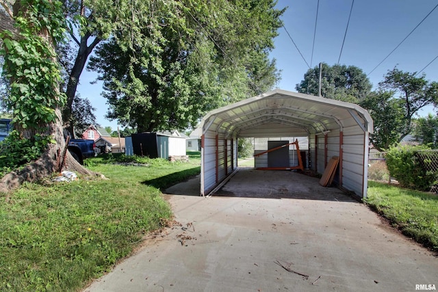 624 Monroe St, Quincy, IL 62301 - view of parking / parking lot featuring concrete driveway and a detached carport