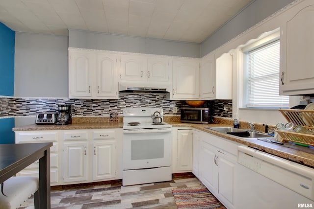 624 Monroe St, Quincy, IL 62301 - kitchen featuring white appliances, exhaust hood, tasteful backsplash, and light wood-type flooring