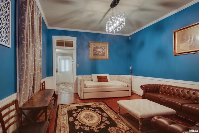 624 Monroe St, Quincy, IL 62301 - living room featuring a wainscoted wall, wood finished floors, and ornamental molding