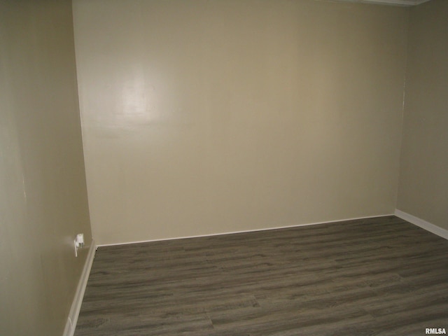1346 Chestnut St, Quincy, IL 62301 - spare room featuring baseboards and dark wood-style flooring