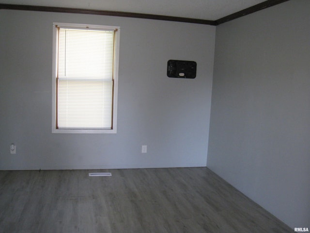 1346 Chestnut St, Quincy, IL 62301 - unfurnished room with ornamental molding and wood finished floors