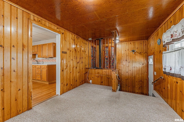 1231 Pulaski St, Lincoln, IL 62656 - carpeted spare room with wooden walls and wooden ceiling