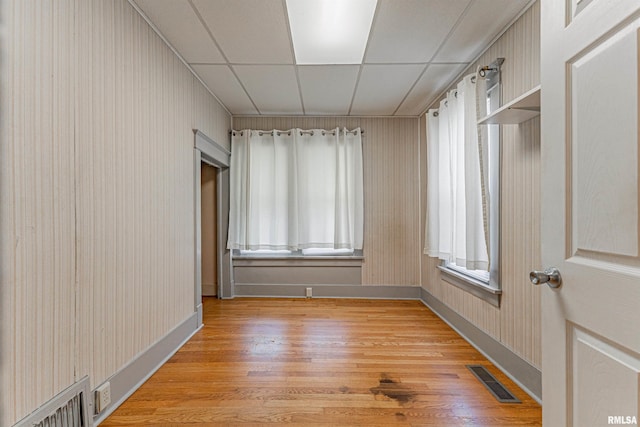 1231 Pulaski St, Lincoln, IL 62656 - spare room with light wood-type flooring and a paneled ceiling