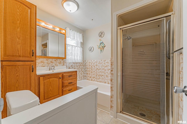 1231 Pulaski St, Lincoln, IL 62656 - full bath with a bath, vanity, a shower stall, and tile patterned flooring