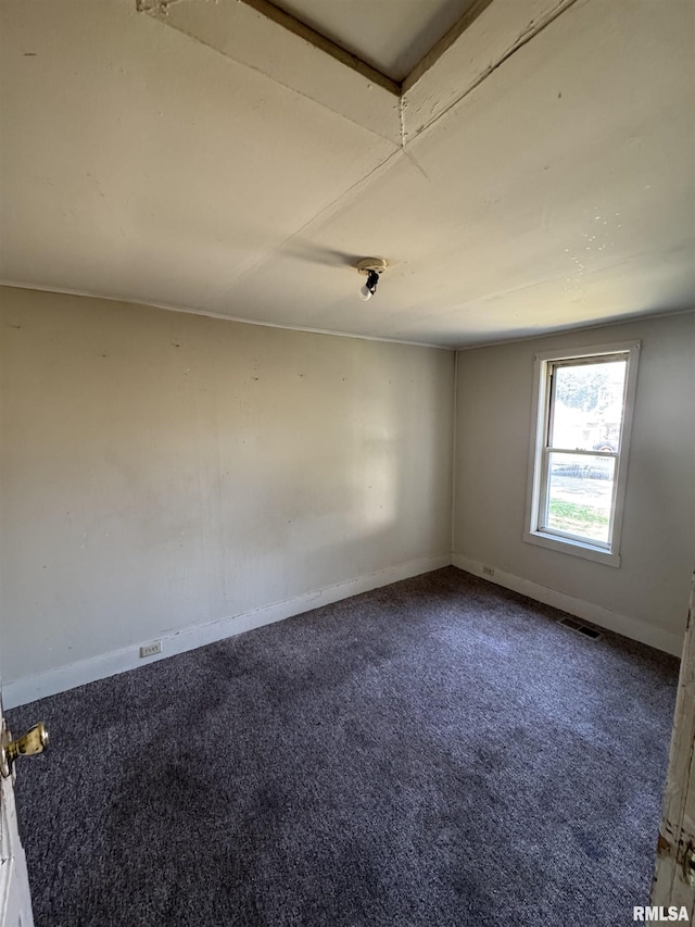 103 S Jackson St, Lincoln, IL 62656 - spare room featuring carpet and baseboards