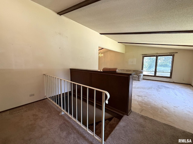 573 Matthews Ct, Oneida, IL 61467 - staircase featuring carpet floors, a textured ceiling, and a chandelier