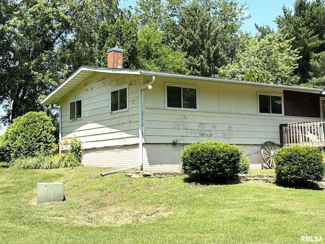 573 Matthews Ct, Oneida, IL 61467 - view of property exterior with a chimney and a yard