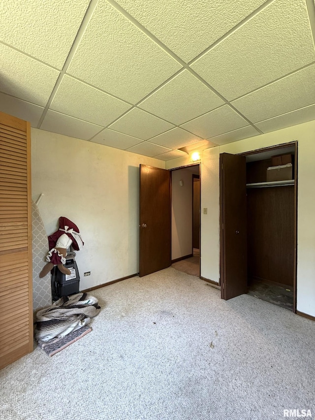 573 Matthews Ct, Oneida, IL 61467 - unfurnished bedroom with a paneled ceiling, carpet floors, and a closet
