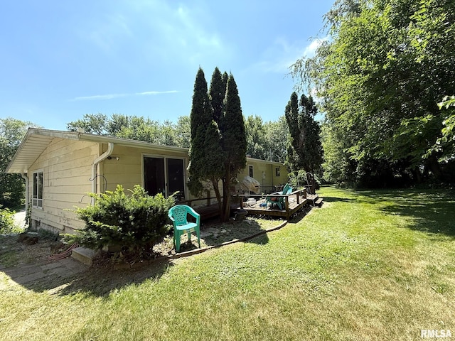573 Matthews Ct, Oneida, IL 61467 - view of grassy yard with a wooden deck