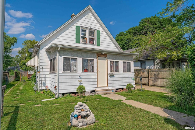 1214 Pekin St, Lincoln, IL 62656 - bungalow with a fenced backyard and entry steps