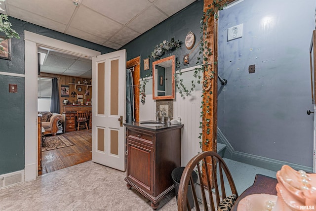 1214 Pekin St, Lincoln, IL 62656 - hallway featuring a drop ceiling and a sink