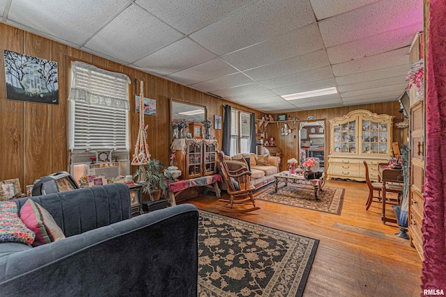 1214 Pekin St, Lincoln, IL 62656 - living room with wood walls, a drop ceiling, wood-type flooring, and cooling unit