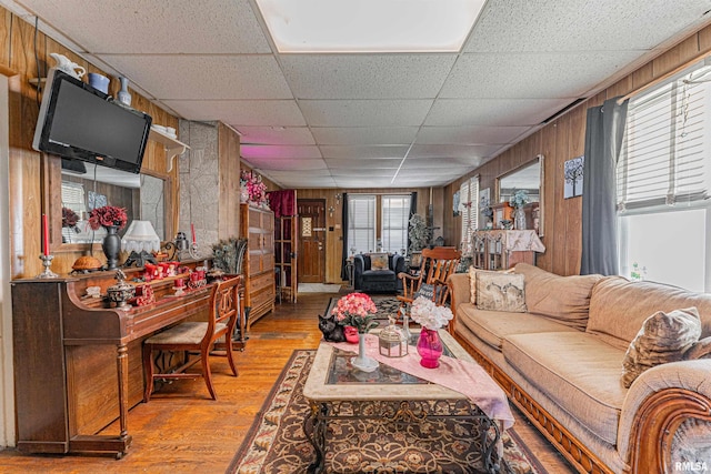 1214 Pekin St, Lincoln, IL 62656 - living area with wood walls, a drop ceiling, and hardwood / wood-style flooring