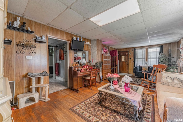 1214 Pekin St, Lincoln, IL 62656 - living room with wood finished floors, wood walls, and a paneled ceiling