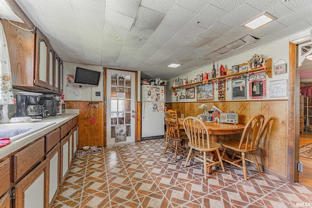 1214 Pekin St, Lincoln, IL 62656 - dining space featuring wood walls and a wainscoted wall