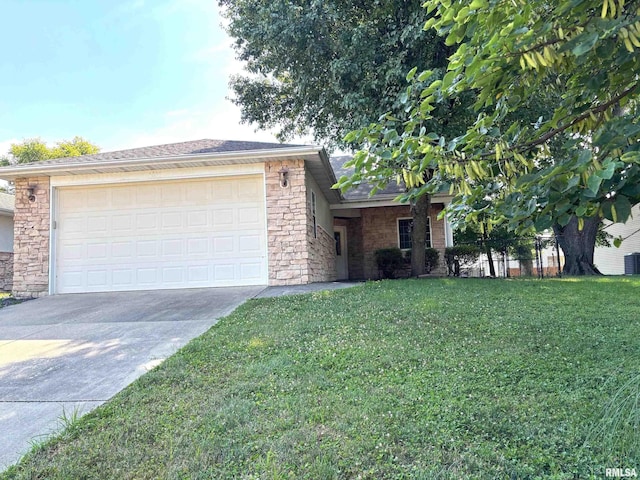 4317 Harvard Dr, Springfield, IL 62712 - view of front of home featuring stone siding, concrete driveway, a front lawn, and an attached garage