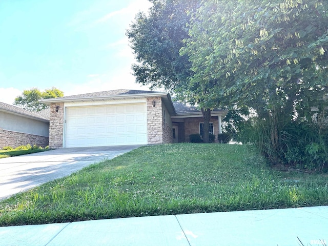 4317 Harvard Dr, Springfield, IL 62712 - single story home with concrete driveway, an attached garage, stone siding, and a front lawn
