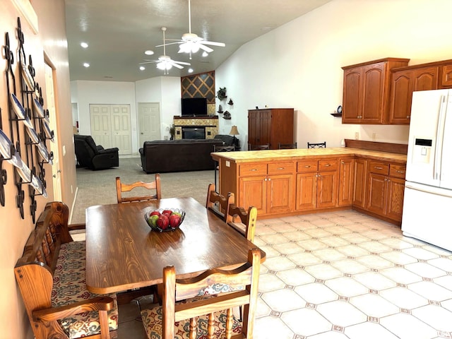 4317 Harvard Dr, Springfield, IL 62712 - dining space with ceiling fan, a glass covered fireplace, vaulted ceiling, and recessed lighting