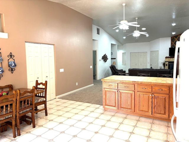 4317 Harvard Dr, Springfield, IL 62712 - kitchen with ceiling fan, open floor plan, a fireplace, high vaulted ceiling, and tile counters