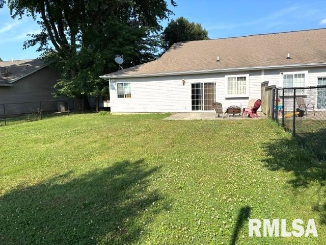 4317 Harvard Dr, Springfield, IL 62712 - rear view of house with a fenced backyard and a patio area