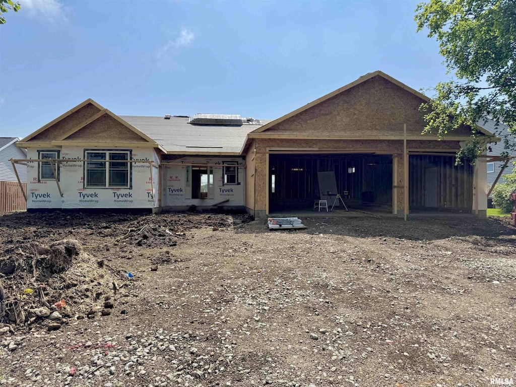 6200 Wind Tree Rd, Springfield, IL 62712 - property in mid-construction with an attached garage and dirt driveway