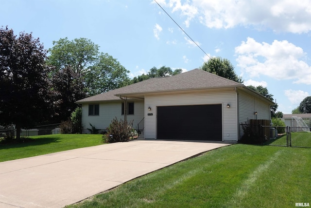 1156 Russell Ave, Galesburg, IL 61401 - single story home featuring driveway, a garage, and a gate