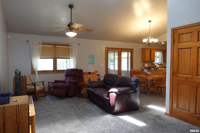 1156 Russell Ave, Galesburg, IL 61401 - carpeted living area featuring a chandelier, a ceiling fan, and vaulted ceiling