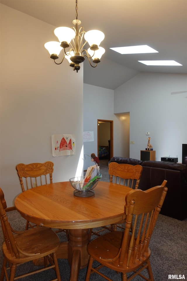 1156 Russell Ave, Galesburg, IL 61401 - carpeted dining room featuring a chandelier, vaulted ceiling, and a skylight
