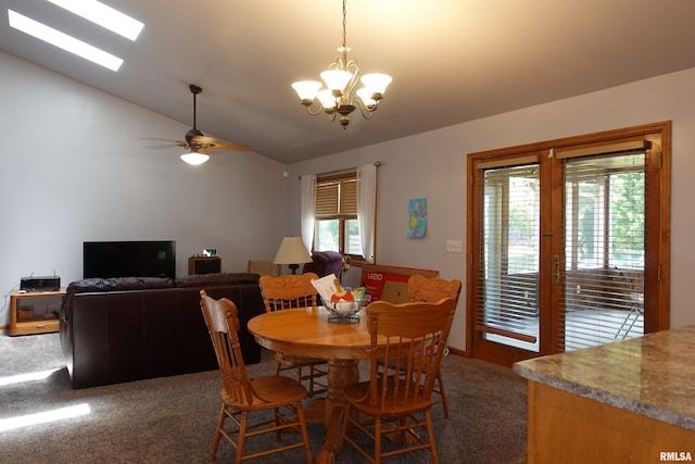 1156 Russell Ave, Galesburg, IL 61401 - dining space featuring dark colored carpet, lofted ceiling, a chandelier, and a ceiling fan