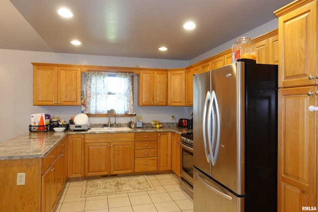 1156 Russell Ave, Galesburg, IL 61401 - kitchen with appliances with stainless steel finishes, light tile patterned floors, stone counters, a peninsula, and brown cabinets