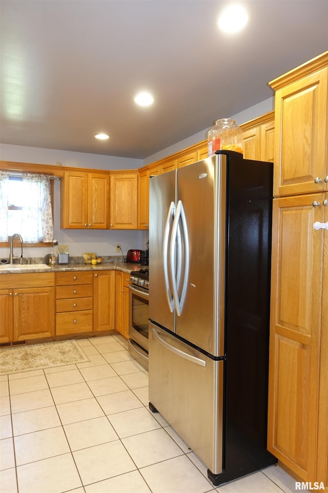 1156 Russell Ave, Galesburg, IL 61401 - kitchen featuring stainless steel appliances, light tile patterned floors, and recessed lighting