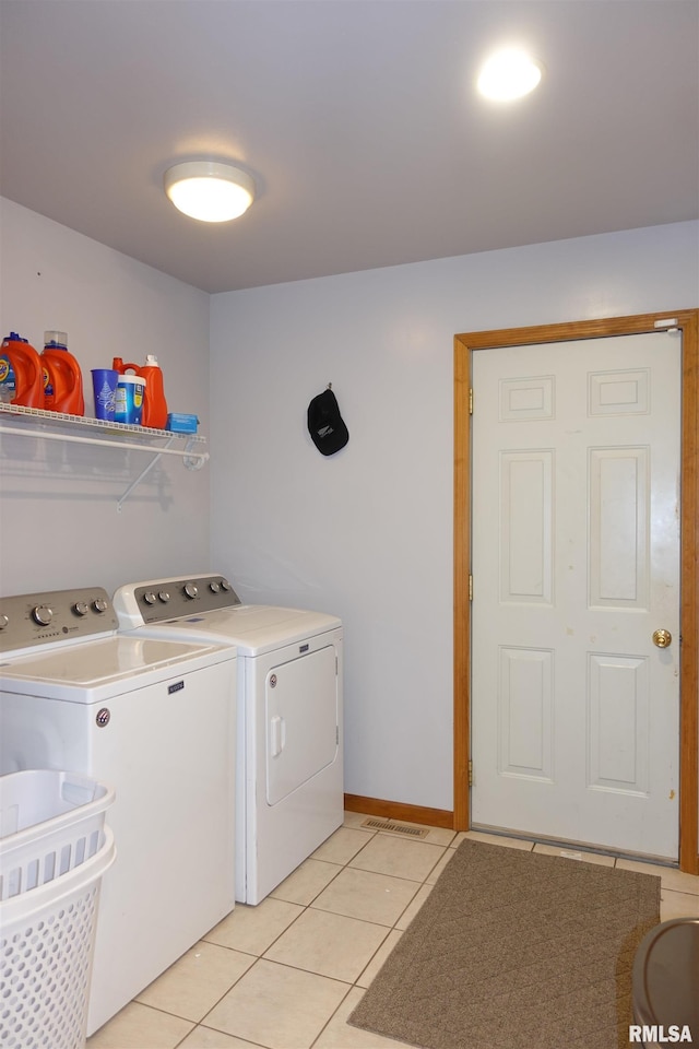 1156 Russell Ave, Galesburg, IL 61401 - laundry room with washer and clothes dryer and light tile patterned flooring