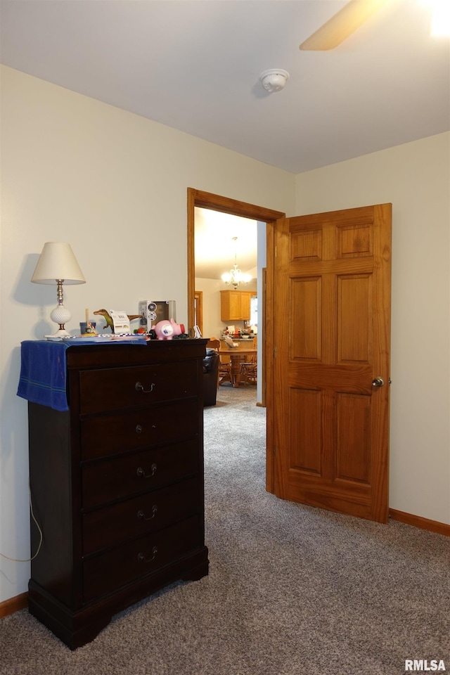 1156 Russell Ave, Galesburg, IL 61401 - carpeted bedroom featuring a chandelier and baseboards
