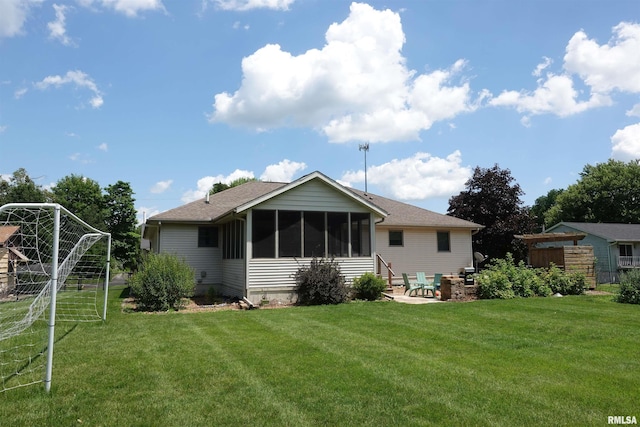 1156 Russell Ave, Galesburg, IL 61401 - back of property featuring a patio, a sunroom, and an area for soccer