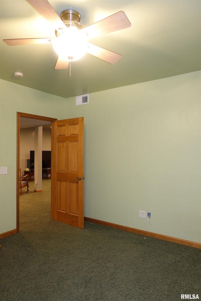 1156 Russell Ave, Galesburg, IL 61401 - empty room with carpet floors, a smoke detector, and ceiling fan