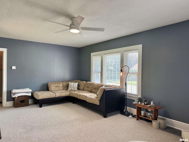 839 E Fremont St, Galesburg, IL 61401 - carpeted living area with ceiling fan and a textured ceiling