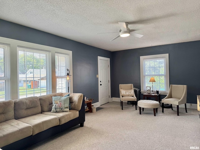 839 E Fremont St, Galesburg, IL 61401 - living area with ceiling fan, a textured ceiling, and carpet