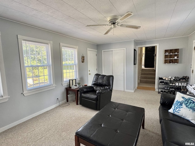 839 E Fremont St, Galesburg, IL 61401 - living room with carpet, stairway, and a ceiling fan