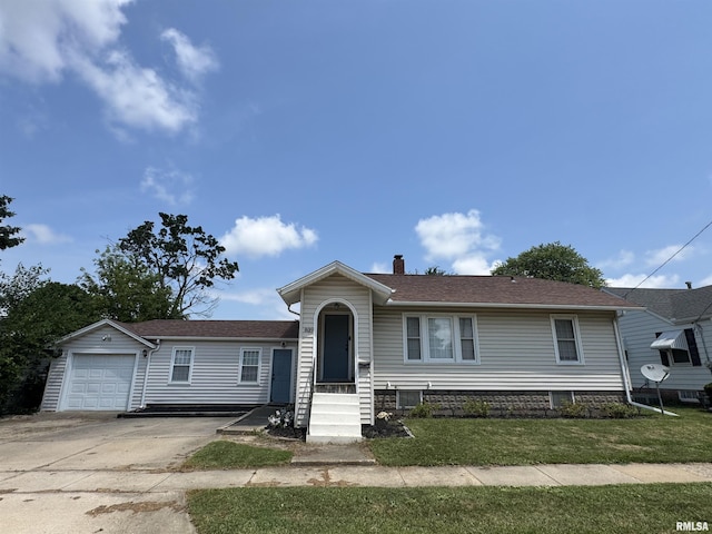 839 E Fremont St, Galesburg, IL 61401 - view of front of house with a chimney, concrete driveway, and a front lawn