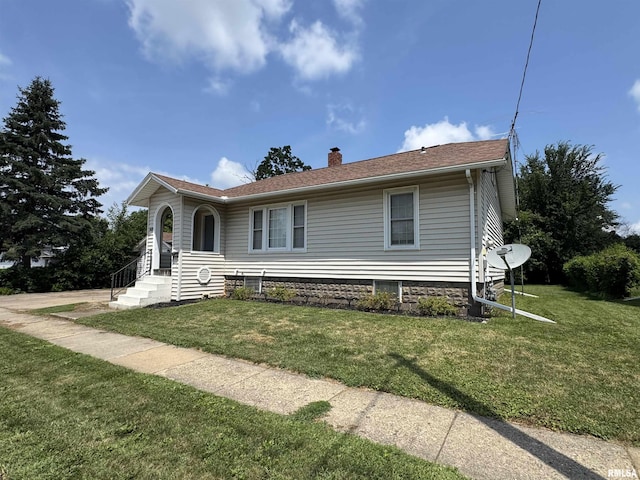 839 E Fremont St, Galesburg, IL 61401 - view of front of property featuring a chimney and a front yard