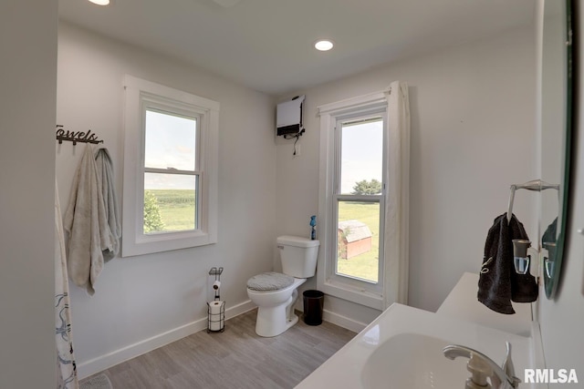 281 N Ave, Plainville, IL 62365 - bathroom featuring healthy amount of natural light, wood finished floors, and recessed lighting