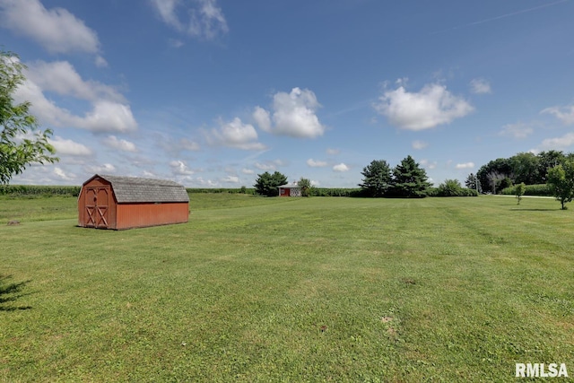 281 N Ave, Plainville, IL 62365 - view of green lawn with a storage shed and a view of countryside