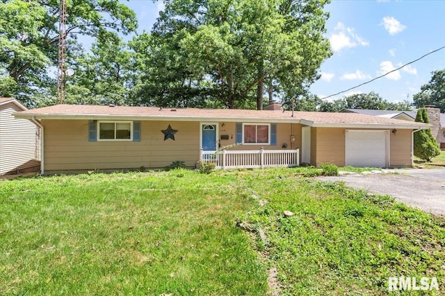 15858 Oak Ln, Girard, IL 62640 - ranch-style home featuring a garage, gravel driveway, covered porch, and a front lawn