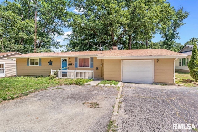 15858 Oak Ln, Girard, IL 62640 - ranch-style house featuring driveway, an attached garage, and a chimney