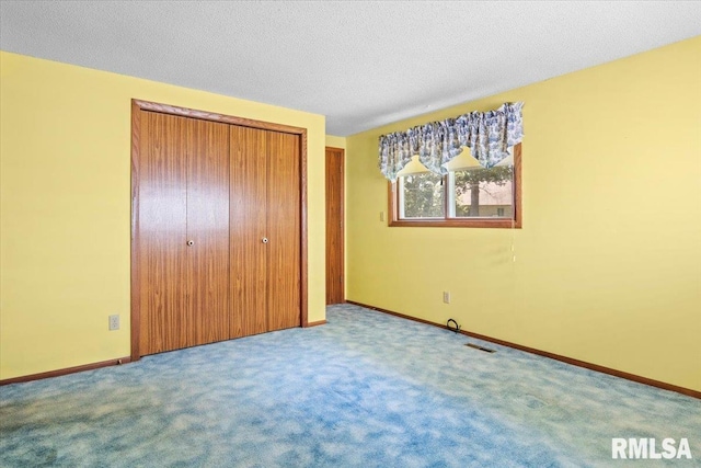 15858 Oak Ln, Girard, IL 62640 - unfurnished bedroom featuring a closet and carpet