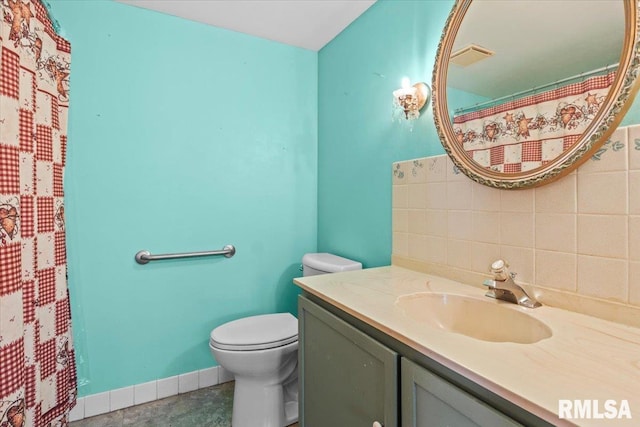 15858 Oak Ln, Girard, IL 62640 - bathroom featuring vanity, decorative backsplash, and a shower with curtain