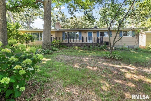 15858 Oak Ln, Girard, IL 62640 - view of front facade with a wooden deck and a front lawn
