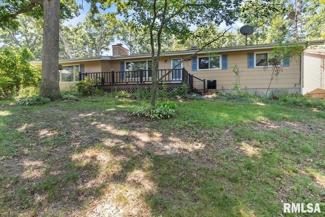 15858 Oak Ln, Girard, IL 62640 - back of property featuring a chimney, a deck, and a lawn