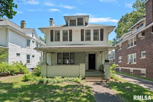 1424 S Lowell Ave, Springfield, IL 62704 - traditional style home with brick siding, a porch, and a front lawn